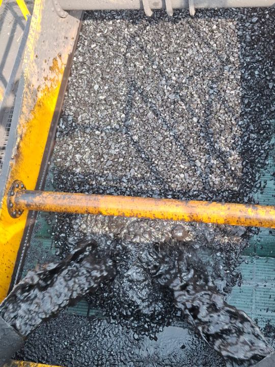 Close-up of material on the vibrating screen deck